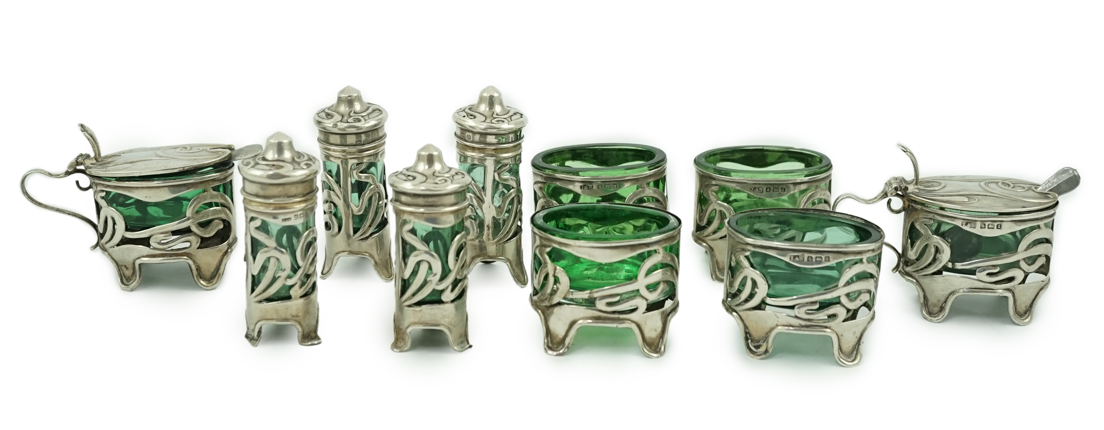 An early 20th century Art Nouveau pierced silver ten piece condiment set by Levy & Salaman